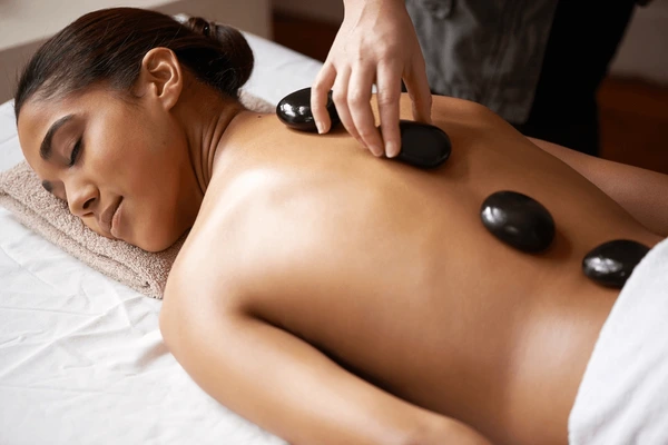 Hot stone massage therapy at Symphony Bali Spa Madurai